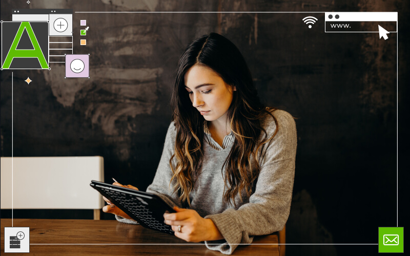long hair brunette woman sitting working on ipad holding ipad pen